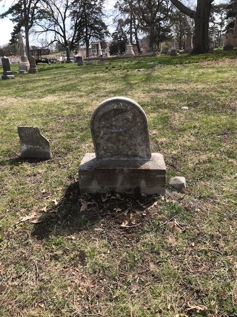The same marble headstone reset square and upright on a repaired base